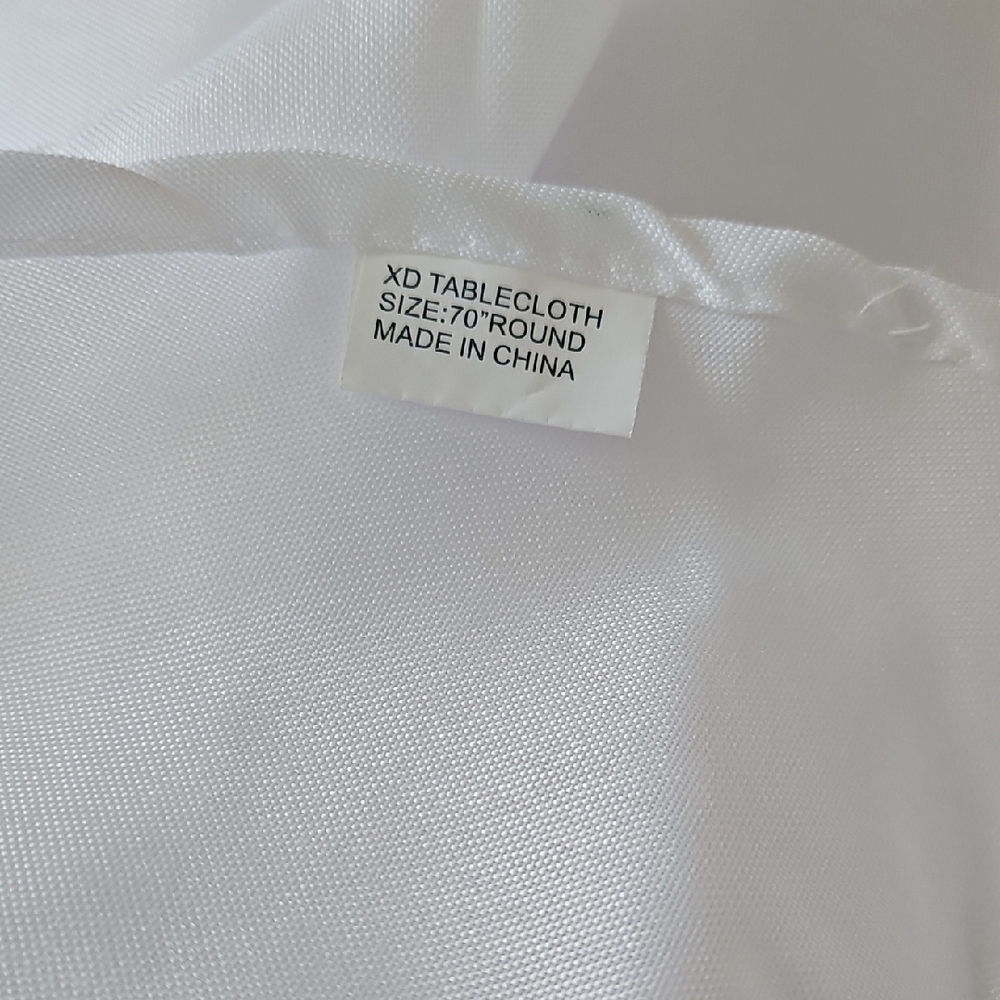 Three  70" Round  White Poly Tablecloths
